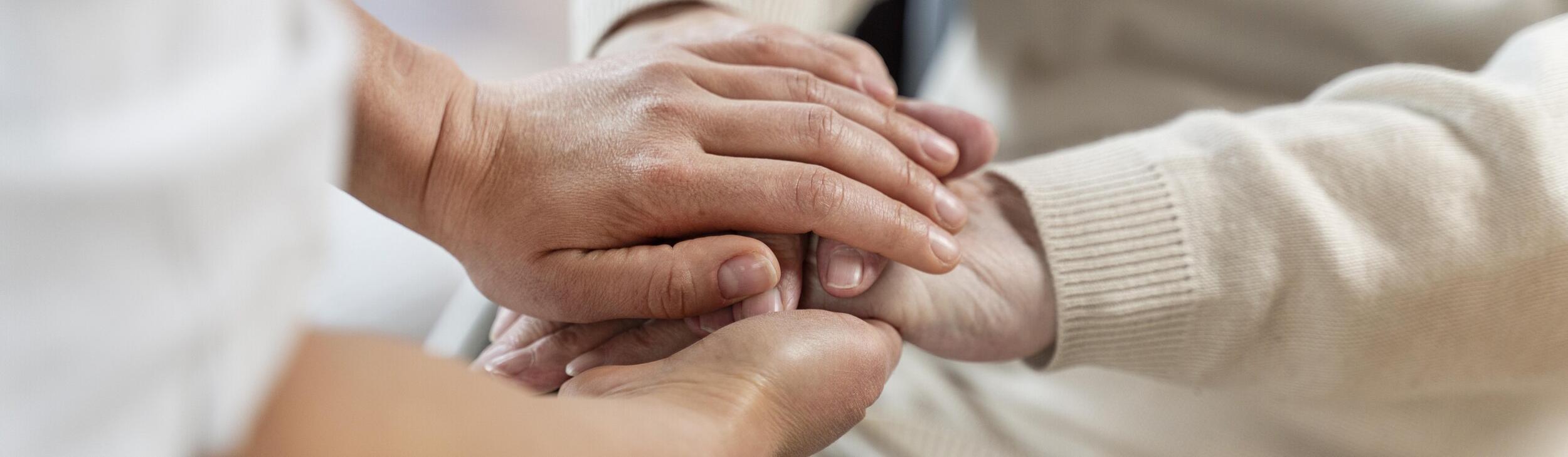 doctor-holding-hands-with-senior-patient